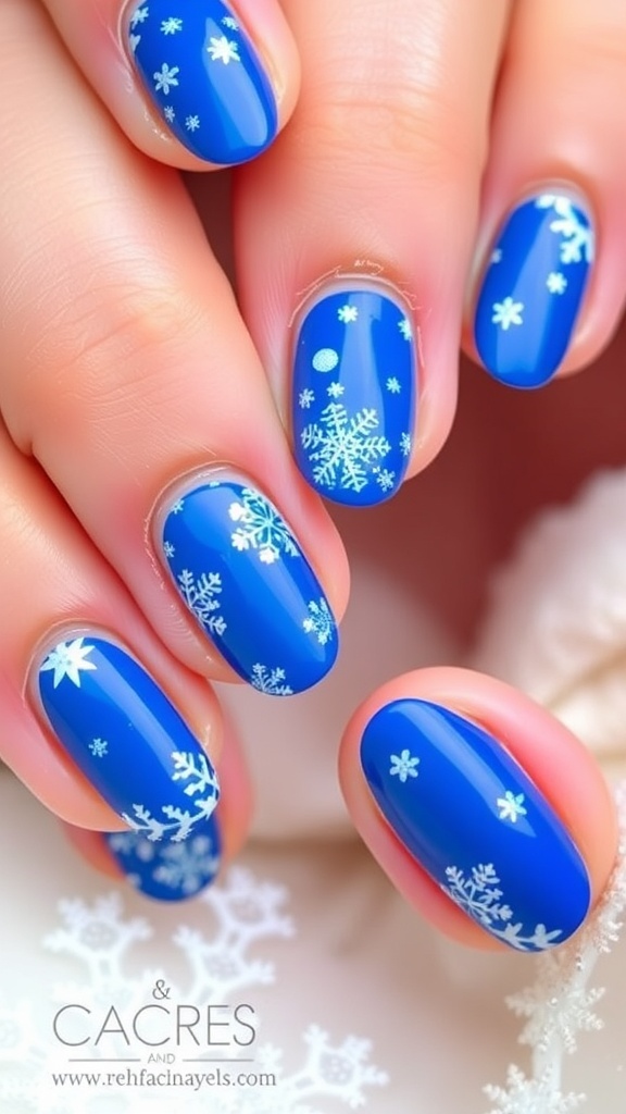 Short oval nails painted blue with Christmas designs and glitter.